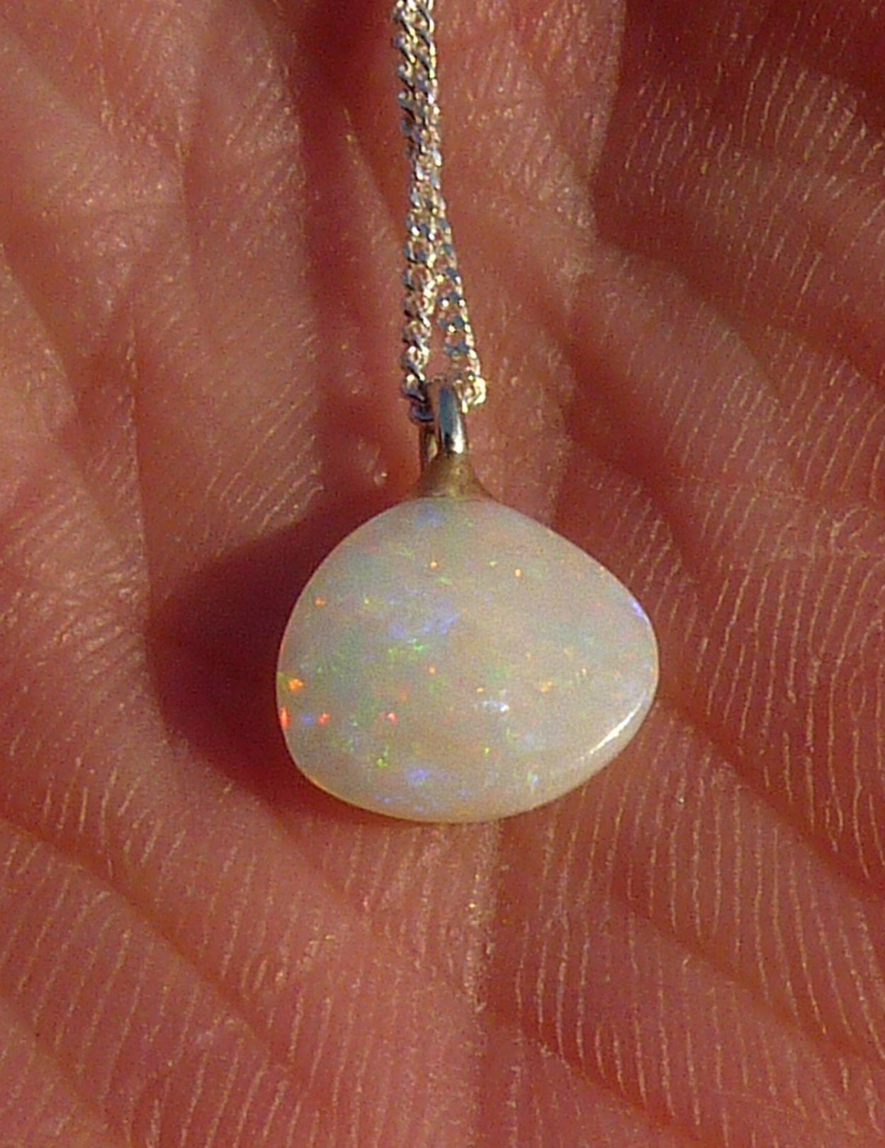 Opalised shell pendant