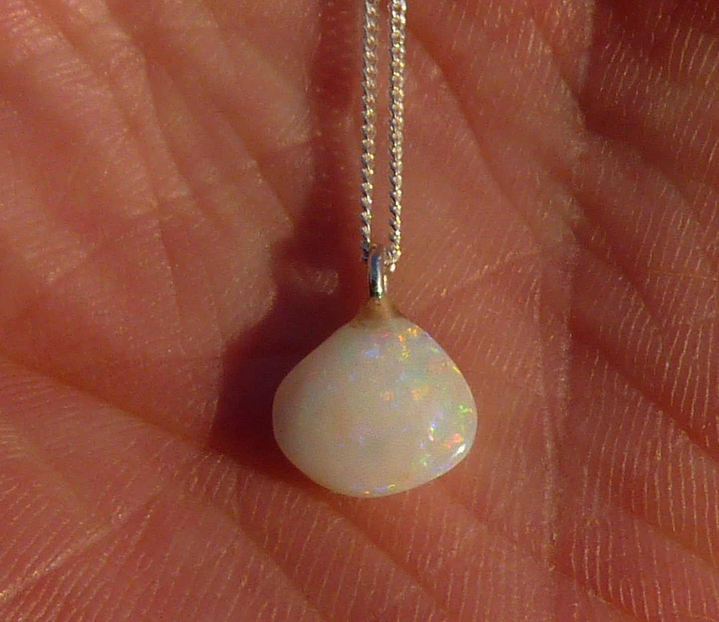 Opalised shell pendant