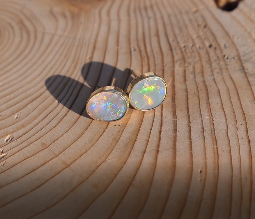 Matching 18k gold opal ear studs