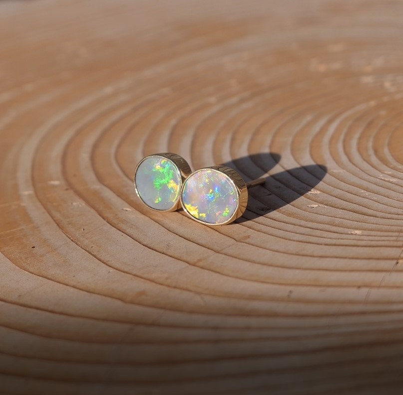 Matching 18k gold opal ear studs