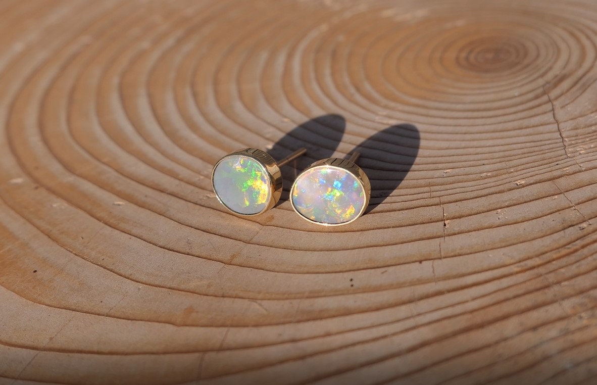 Matching 18k gold opal ear studs