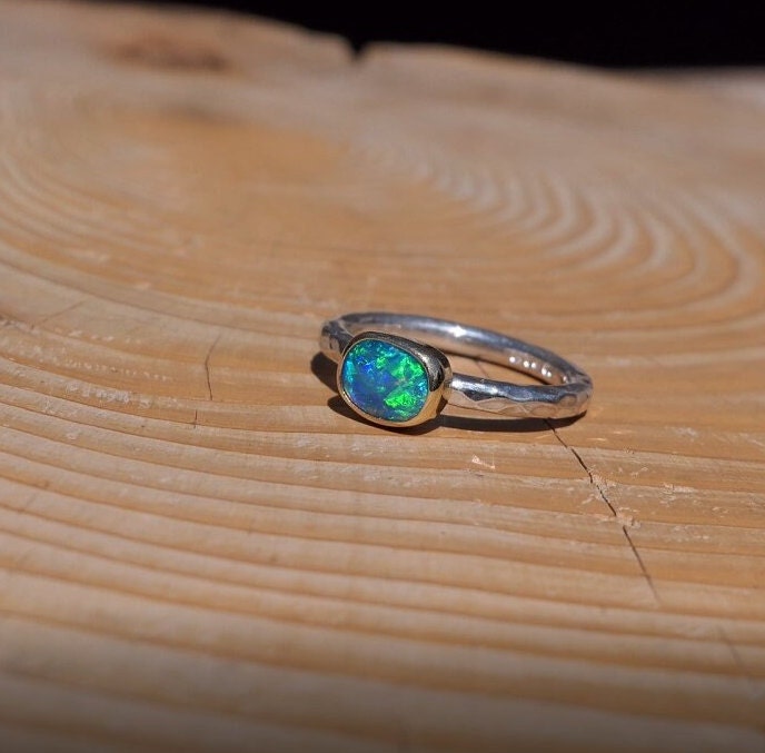 Lightning Ridge opal ring with 18k gold bezel