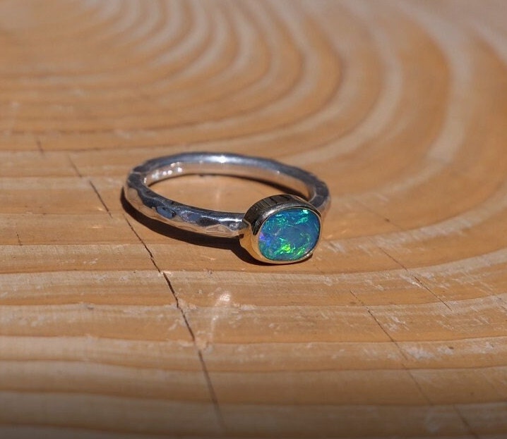 Lightning Ridge opal ring with 18k gold bezel