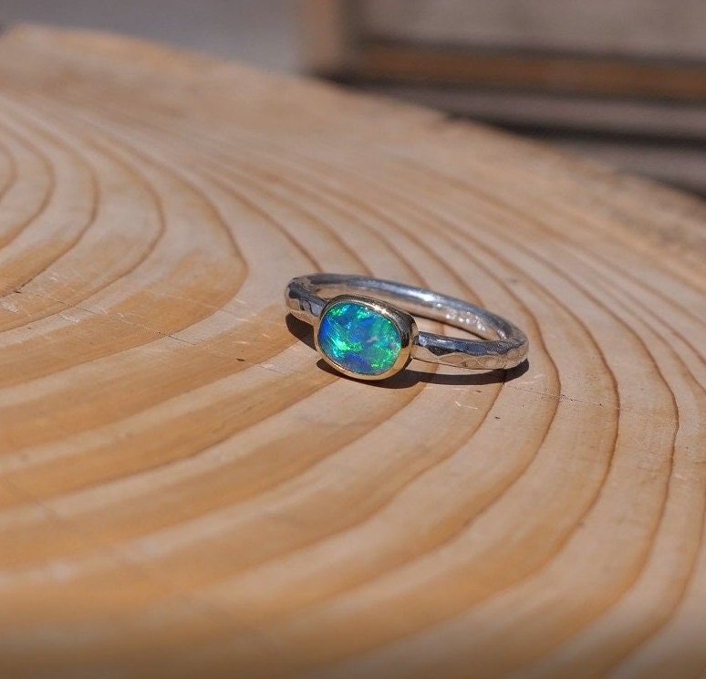 Lightning Ridge opal ring with 18k gold bezel