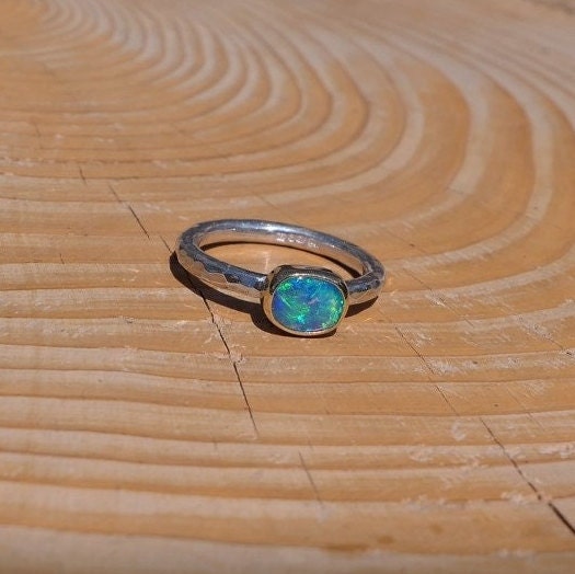 Lightning Ridge opal ring with 18k gold bezel