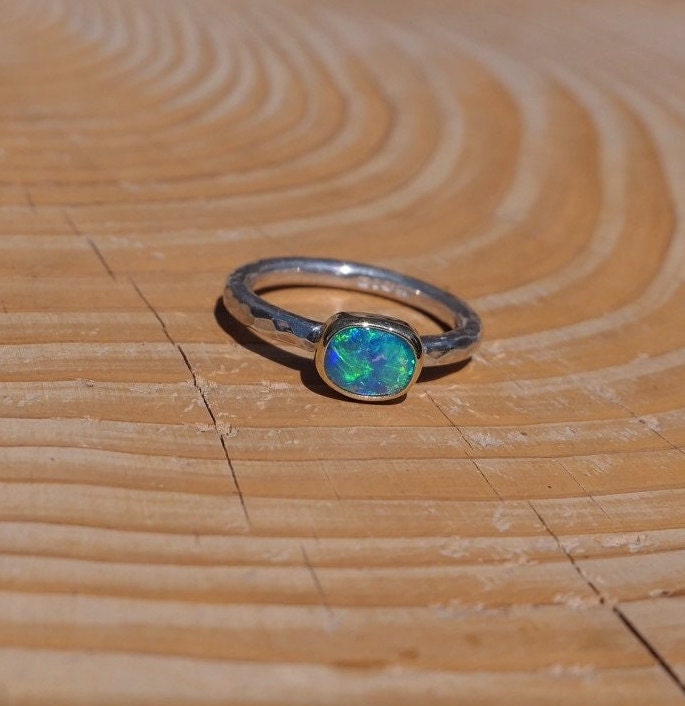 Lightning Ridge opal ring with 18k gold bezel