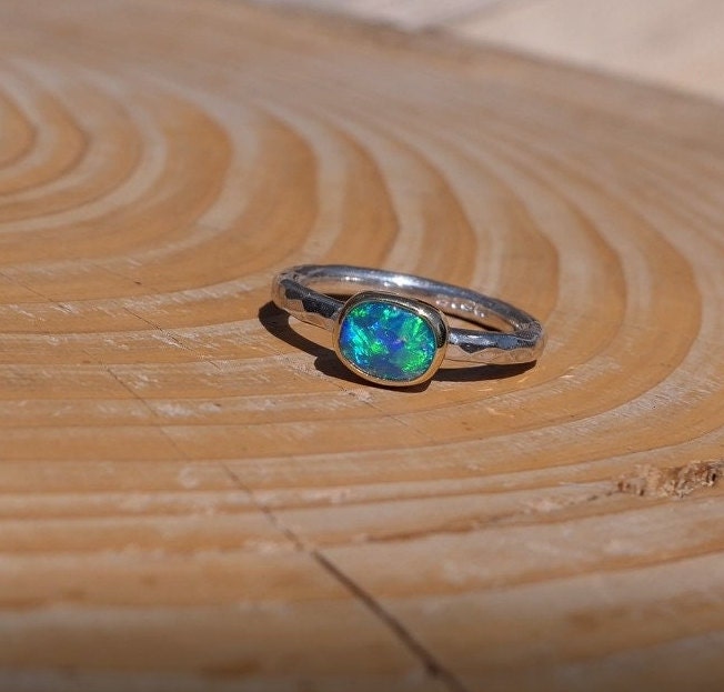 Lightning Ridge opal ring with 18k gold bezel