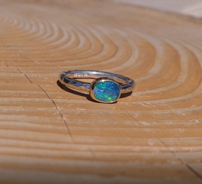 Lightning Ridge opal ring with 18k gold bezel