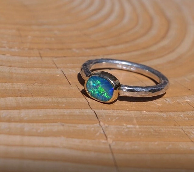 Lightning Ridge opal ring with 18k gold bezel